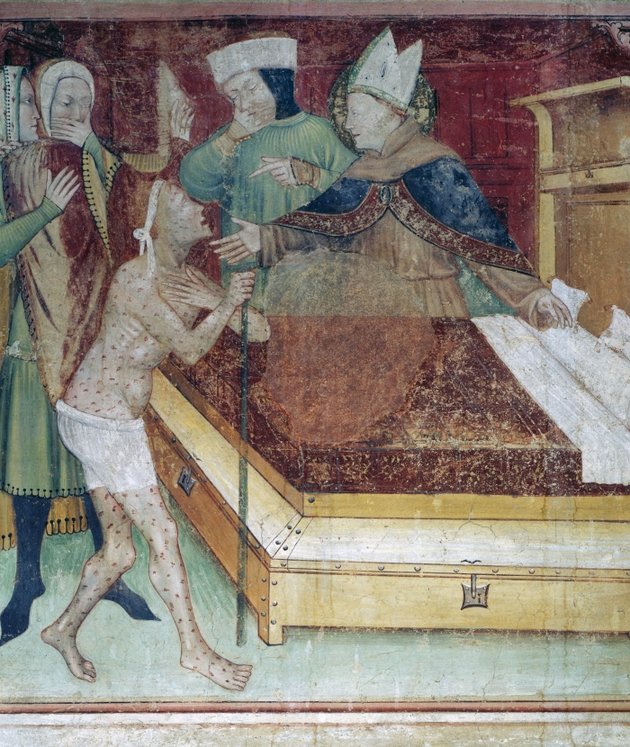 Toulouse-i Szent Lajos fektet az ágyába egy leprás beteget
