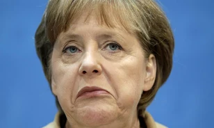 
	Találgatás indult Angela Merkel NDK-s múltjáról
